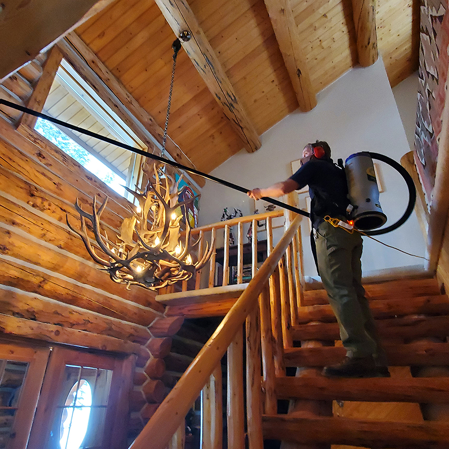High Interior Cleaning - vacuuming and dusting walls, beams, and ceilings (Peak Window Cleaning).