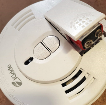 High Interior Cleaning - changing smoke alarm batteries and light bulbs (Peak Window Cleaning).